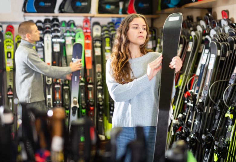 Man and Woman buying skis