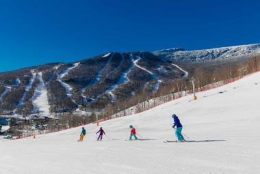 Group of skiers going down the mountain