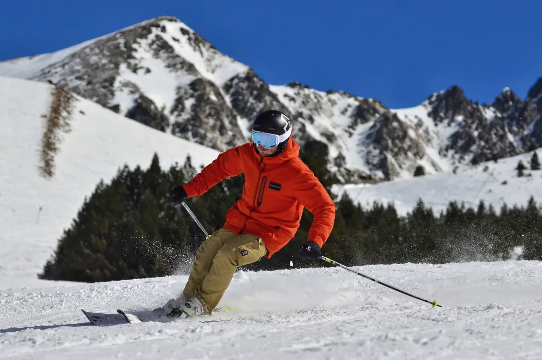 Skier with orange jacket