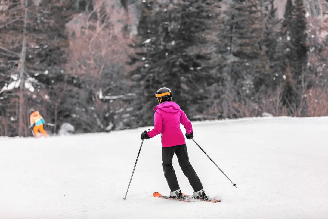 Skier woman skiing learning to ski
