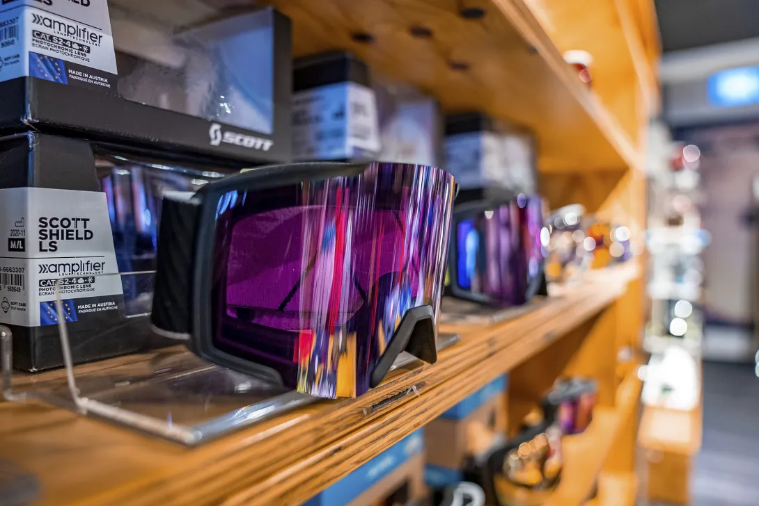variety of ski goggles in sports equipment store