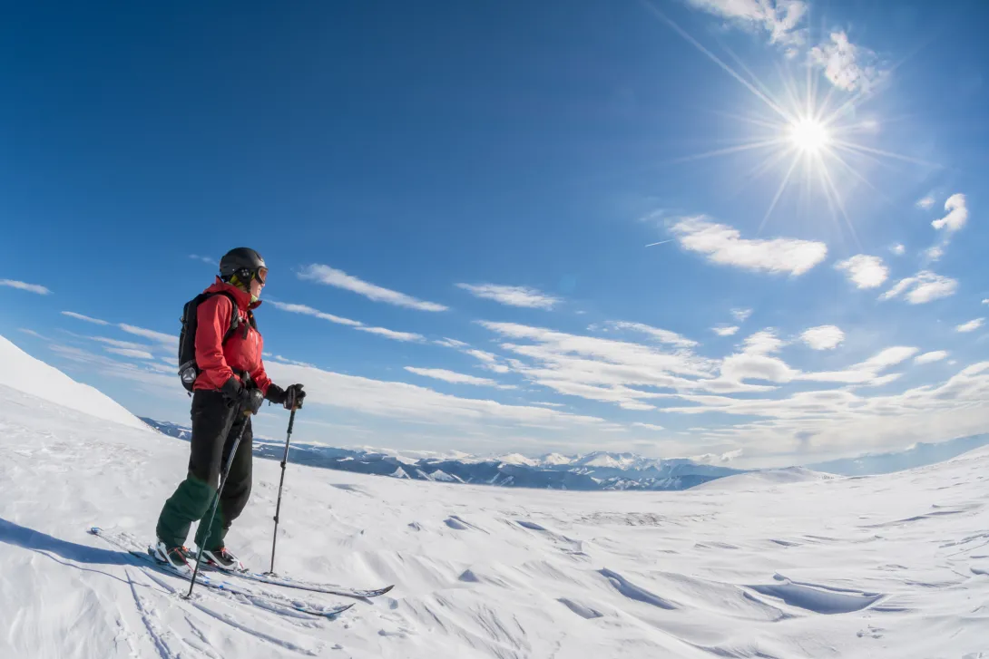 Skier with backpack