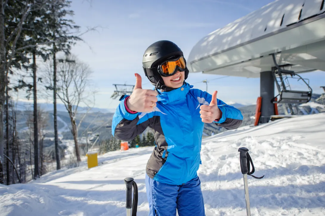 thumbs up from skier