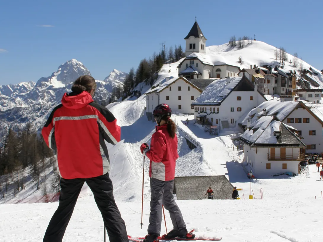 Skiers in front of town