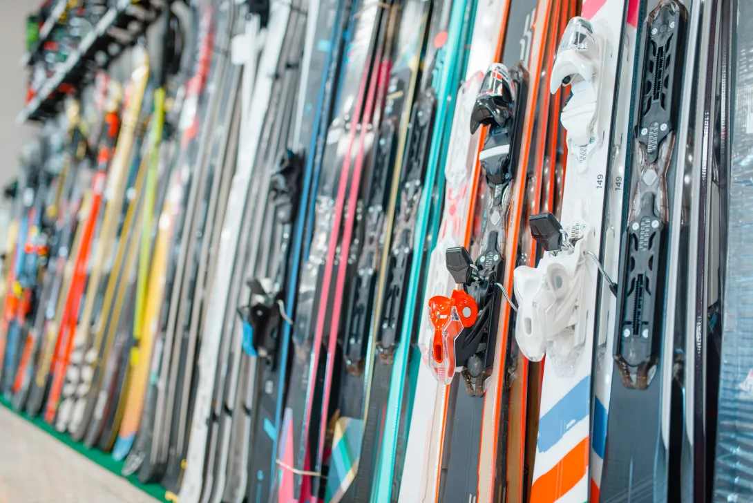 Skis on a rack in a shop