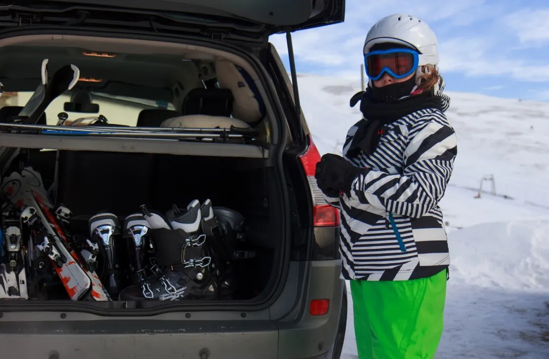 Girl with ski equipment