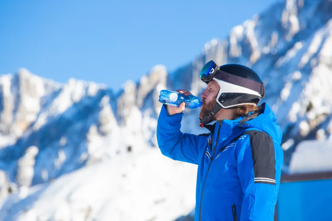 Skier drinking water