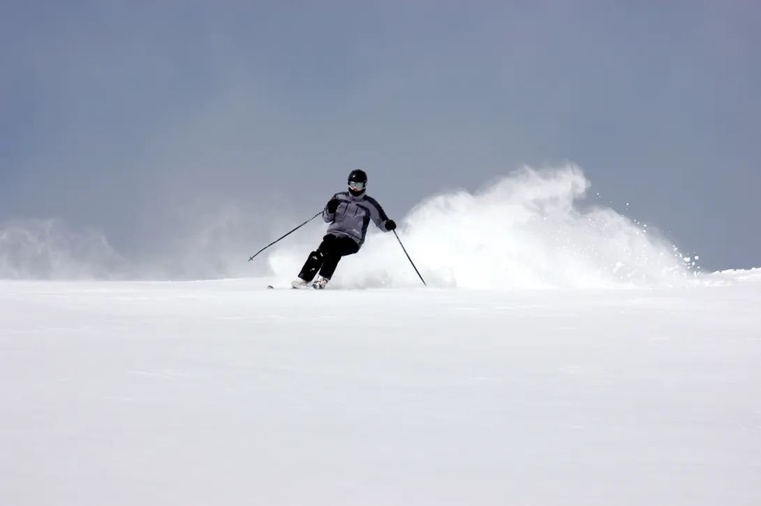 Skier heading down