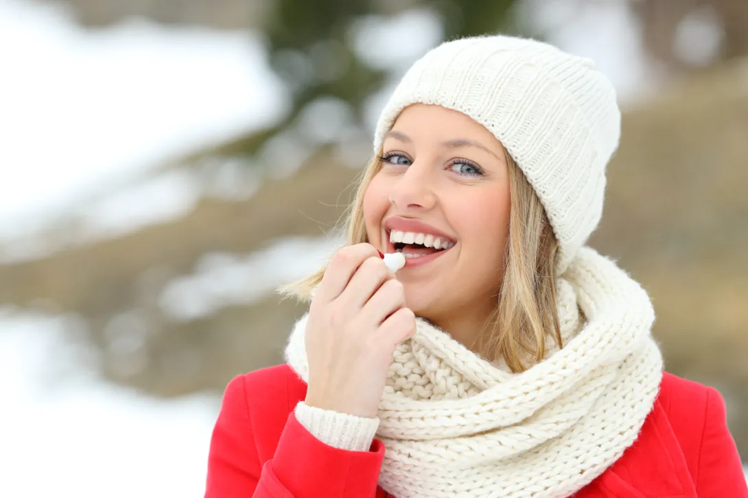 Woman with lip balm