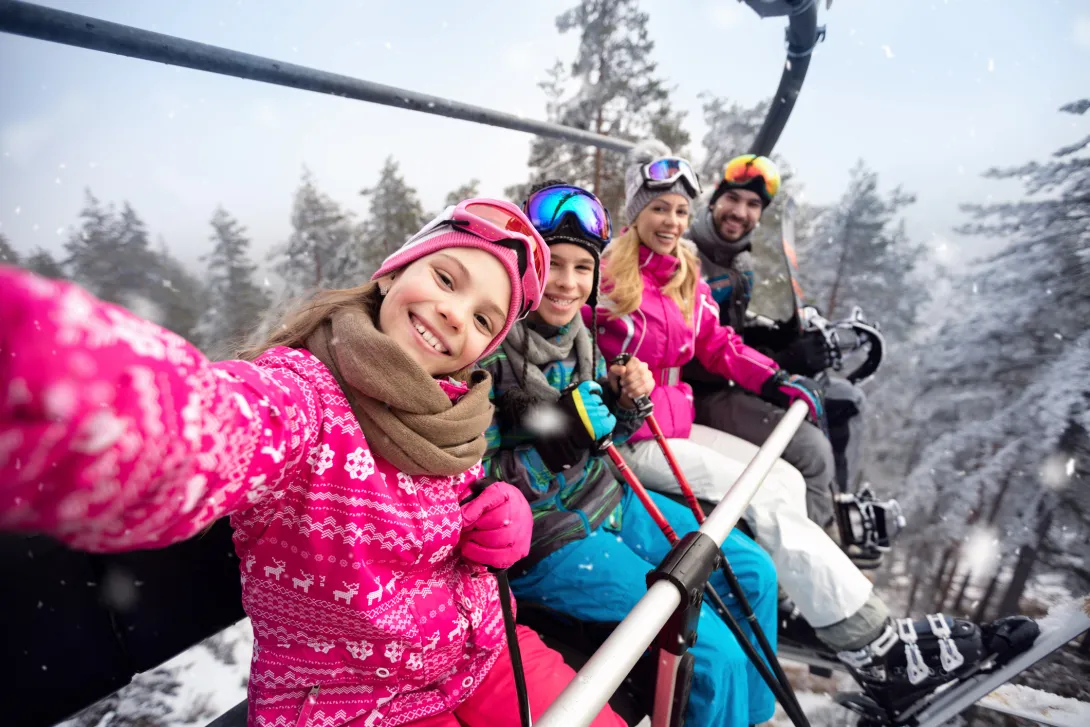 family on ski lift