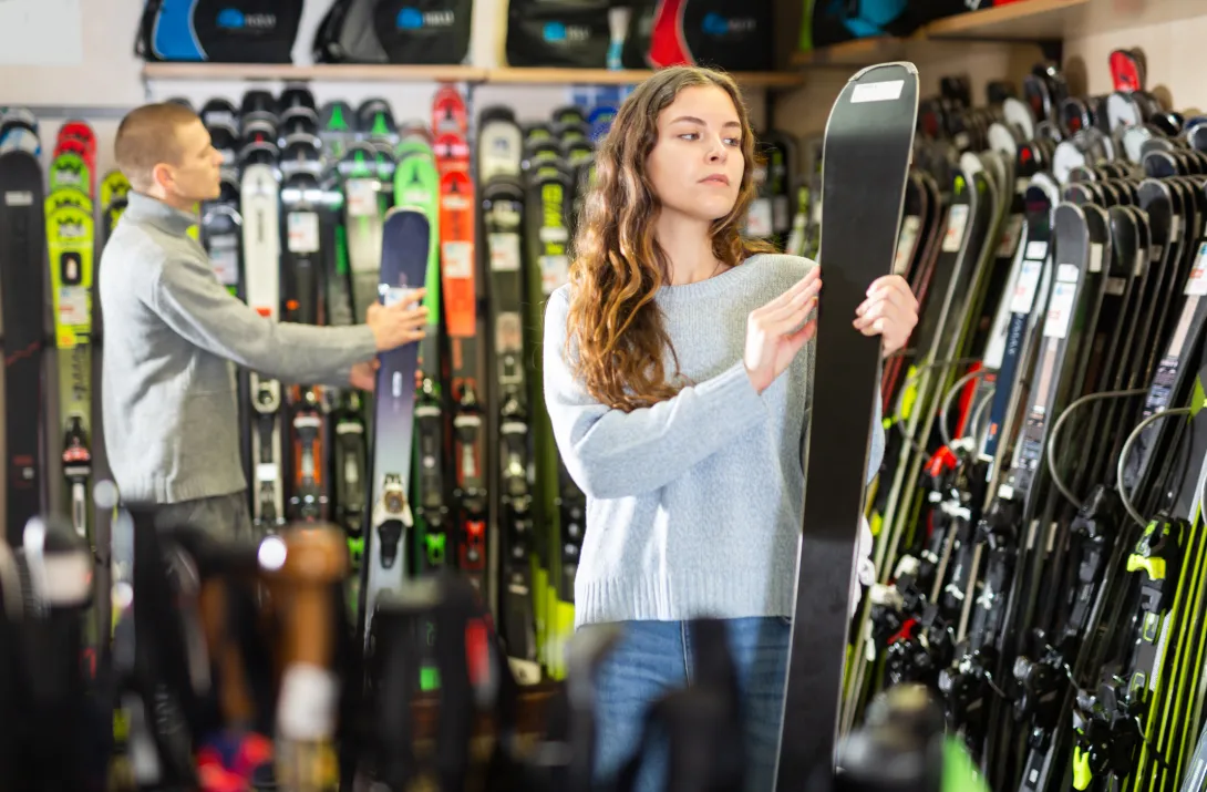 Man and Woman buying skis