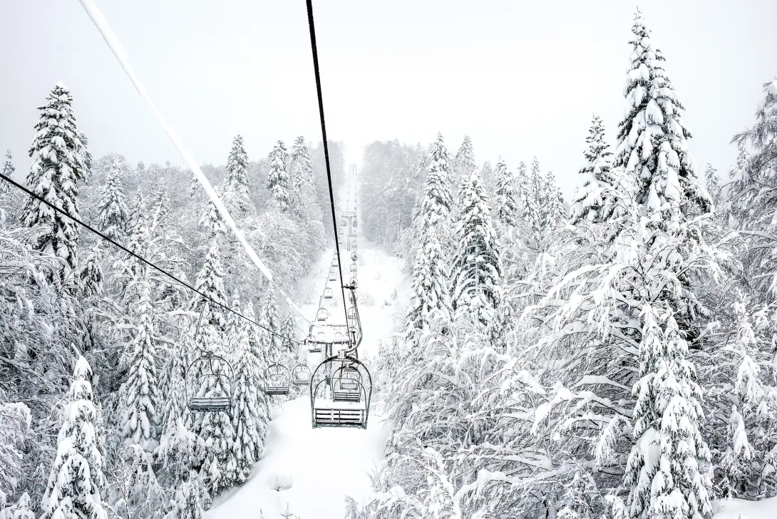 Ski chair lift covered in snow