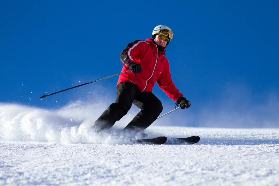 Skier turning on mountain
