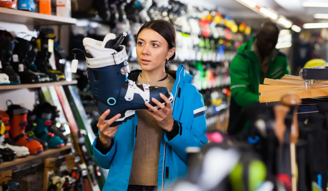 Woman choosing ski boots